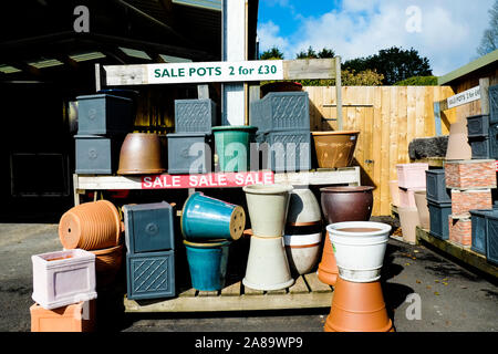 Various ceramic pots and plant containers on sale in a garden nursery centre. Stock Photo