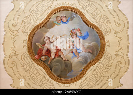 MENAGGIO, ITALY - MAY 8, 2015: The neobaroque  fresco of angels with the holy water in church Chiesa di Santa Marta. Stock Photo