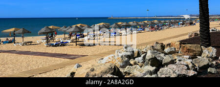 Summer view over Quarteira beach, Vilamoura town, Algarve, Southern Portugal, Europe Stock Photo