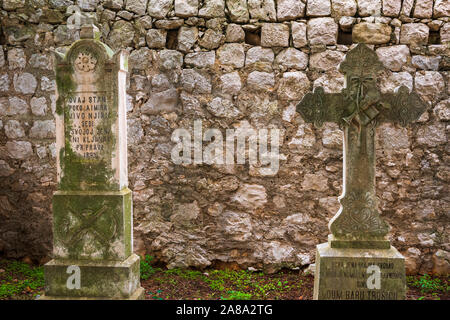 Graves in the cemetery at St Stephen Church, Zaton, Dalmatian Coast, Croatia Stock Photo