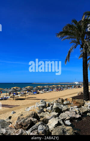 Summer view over Quarteira beach, Vilamoura town, Algarve, Southern Portugal, Europe Stock Photo