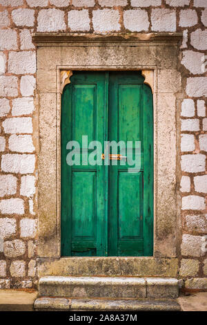 Green door at St Stephen Church, Zaton, Dalmatian Coast, Croatia Stock Photo