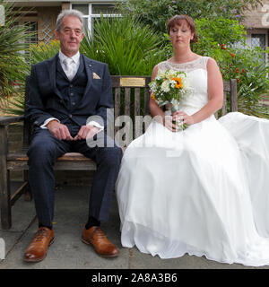 Captured here is Father Terry and daughter Kate prior to leaving for the wedding ceremony. Feeling the love, remembering mum/wife. Stock Photo