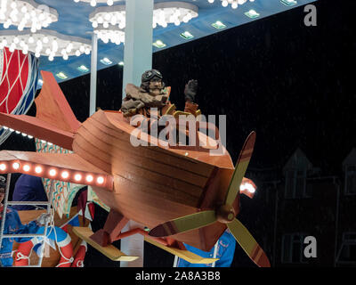 Burnham-on-Sea, Somerset, England, 4th November 2019. Person in costume on a float taking part in the 73rd Highbridge and Burnham-on-Sea carnival. Roads were closed to traffic and the procession of floats and other exhibits took two hours to complete the route through the town. Raining Stock Photo