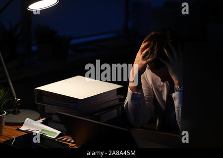 Exhausted business employee Stock Photo
