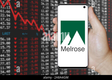 Logo of public company Melrose Industries displayed on a smartphone. Negative stock market background. Credit: PIXDUCE Stock Photo