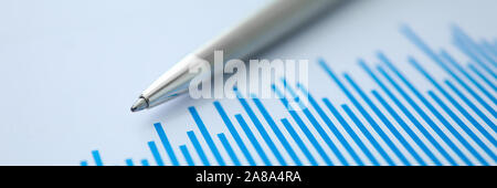 Silver pen lies on paper documents with color Stock Photo