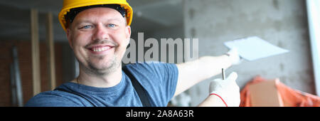 Cheerful builder looking at camera Stock Photo