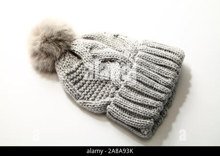 Grey winter warm bobble hat with pom pom isolated on a white background Stock Photo