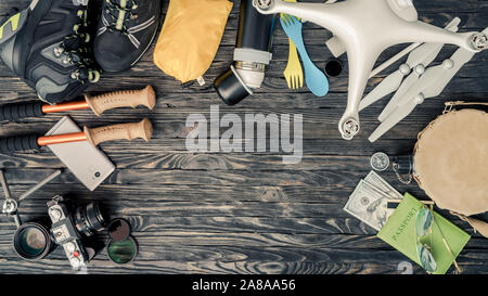 Top view of traveling items on wooden background Stock Photo