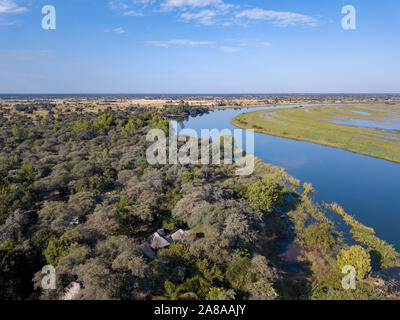 Okavango delta Aerial landscape in Namibia and Angola border. River with shore and green vegetation after rainy season. Africa aerial landscape. Stock Photo