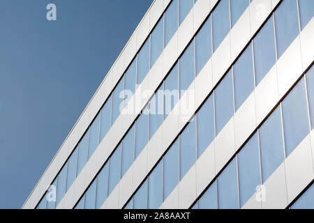Abstract texture, rows of clean windows, clear blue sky as a background Stock Photo