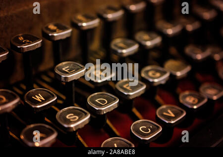 The glass-topped keys of a vintage 1940s Royal KMM typewriter are pictured at the  Pensacola Lighthouse and Museum in Pensacola, Florida. Stock Photo
