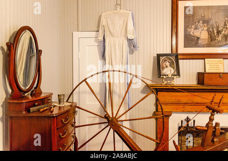 A vintage spinning wheel stands in a lighthouse keeper’s bedroom at the  Pensacola Lighthouse and Museum, Oct. 27, 2019, in Pensacola, Florida. Stock Photo