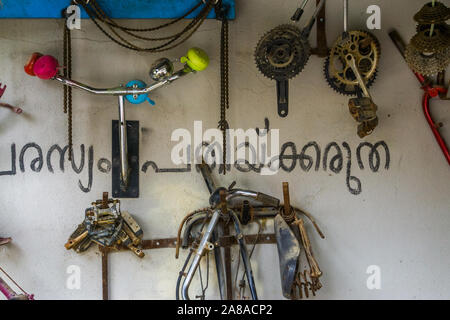 wall with bicycle parts on a wall, the inside of bike workshop, cycle repair background Stock Photo