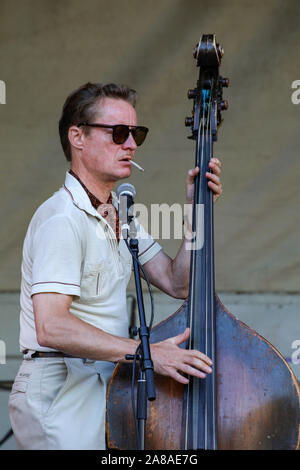 Mitja Tuurala smoking and playing double bass on stage with Pietarin Spektaakkeli at Valli Festival in Helsinki, Finland Stock Photo