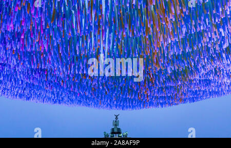 Berlin, Germany. 7th November 2019.  Art installation Visions in Motion by Patrick Shearn of Poetic Kinetics with coloured ribbons for visitors to write messages on in front of the Brandenburg Gate, to mark the 30th Anniversary of the fall of the Berlin Wall.  Iain Masterton/Alamy Live News. Stock Photo