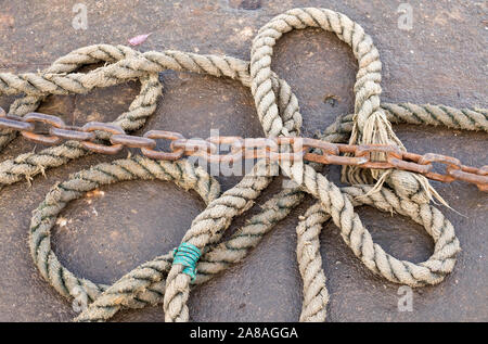 Mooring rope and rusty vhain image Stock Photo