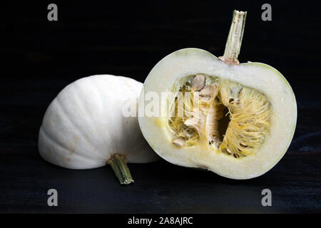Raw white pumpkin that has been cut in half Stock Photo