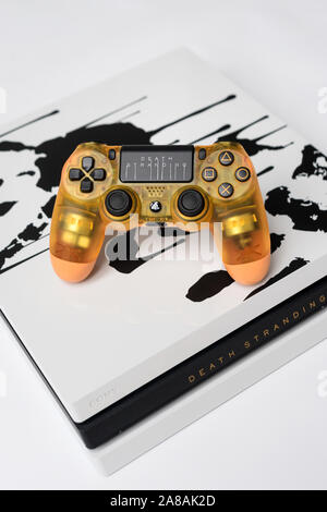 KIEV, UKRAINE - November 07, 2019: Death Stranding Limited Edition PS4 Pro.  Transparent dualshock controller for PlayStation 4 on yellow fabric Stock  Photo - Alamy