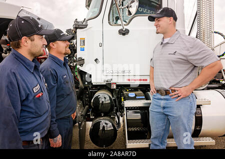 A Mack Trucks service manager talks with technicians at Bruckner Truck Sales, Nov. 16, 2017, in Farmington, New Mexico. Stock Photo
