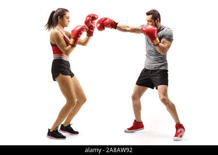 Full length shot of a man and woman boxing isolated on white background Stock Photo