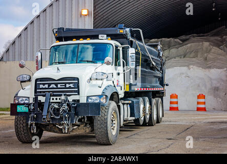 A Mack Granite truck waits to be loaded with salt at the Tennessee Department of Transportation’s salt barns, March 13, 2018, in Knoxville, Tennessee. Stock Photo