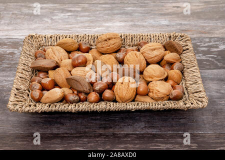 Mixed nuts in a basket Stock Photo