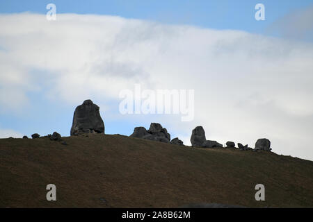 Cloud formations waft over the rocky landscape at Castle Hill, South Island, New Zealand Stock Photo