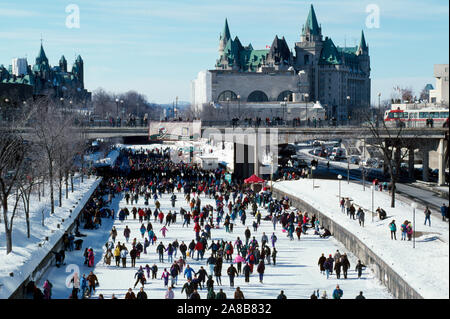 People ice skating on frozen Rideau Canal in winter, Ottawa, Canada Stock Photo