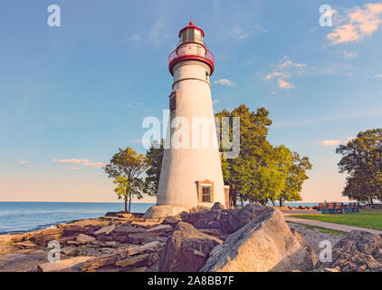 Dramatic autumn scenic Marblehead Peninsula and Lighthouse on rocky shore of Lake Erie, American Great Lakes Marblehead Lighthouse State Park Ohio Stock Photo