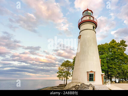 Ohio travel beautiful romantic sunset Marblehead Lighthouse State Park on Lake Erie one of America's Great Lakes, Marblehead Peninsula rocky lakeshore Stock Photo