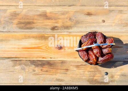 Ramadan Kareem. Dates on wooden background Festive still life with copy space. Stock Photo