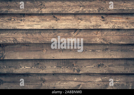 Dark old timber planks. Dirty brown fence. Wooden rough surface. Dark board pattern, grunge fence. Hardwood natural background. Wood material, texture Stock Photo