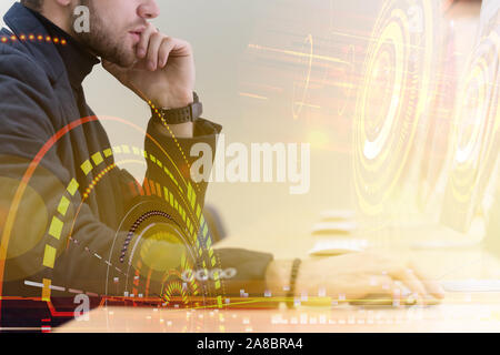 Young male Businessman working on modern computer. Businessman using innovative technologies. Businessman working on computer, software developing wit Stock Photo