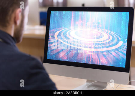 Young male Businessman working on modern computer. Businessman using innovative technologies. Businessman working on computer, software developing wit Stock Photo