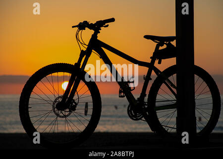 The Bike Down at The Beach at Sun Rise Stock Photo