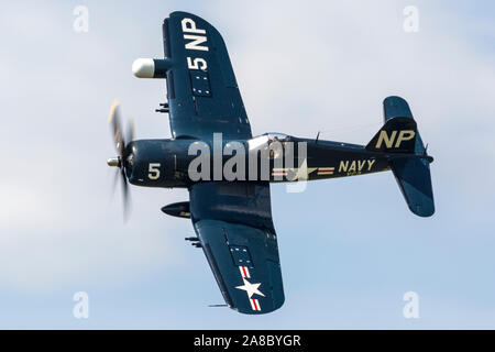 An F4U Corsair performs a flyby at the 2019 Thunder Over Michigan Airshow. Stock Photo