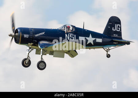 An F4U Corsair performs a flyby at the 2019 Thunder Over Michigan Airshow. Stock Photo
