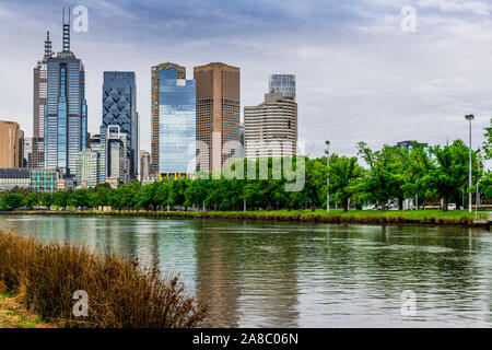 A typical overcast and stormy Melbourne day, with the Yarra River and the city skyline reflected in the water. Stock Photo