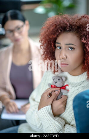 Woman suffering after losing baby in car accident Stock Photo