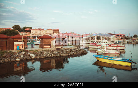 Nesebar, Bulgaria - July 20, 2014: Nesebar old town landscape with colorful fishing boats moored in port Stock Photo