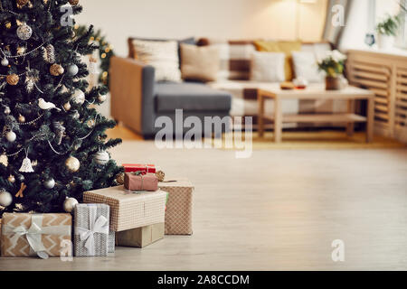 Close-up of decorated Christmas tree with gift boxes on the floor ready for Christmas holidays Stock Photo