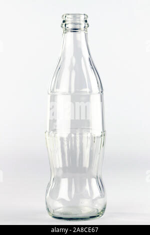 Coca Cola glass bottle withouth brand logo on the white background, editorial Stock Photo