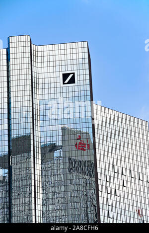 Deutsche Bank headquarters in Frankfurt with logo and reflection of the Sparkassen logo in the facade Stock Photo