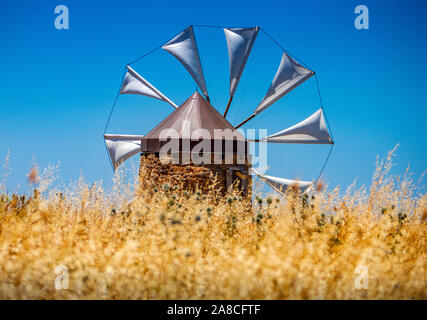 Old windmill in the mountains on the island of Crete, Greece. Stock Photo