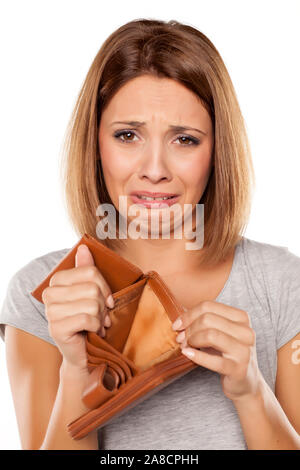 unhappy woman shows her empty wallet Stock Photo