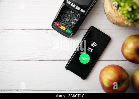 nfc contactless payment with phone. copy space top view Stock Photo