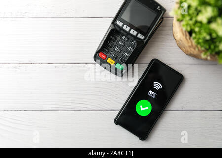 nfc contactless payment with phone. copy space top view Stock Photo