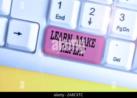 Handwriting text writing Learn Make Repeat. Conceptual photo Once you do it will be easy fast learner fix mistakes White pc keyboard with empty note p Stock Photo